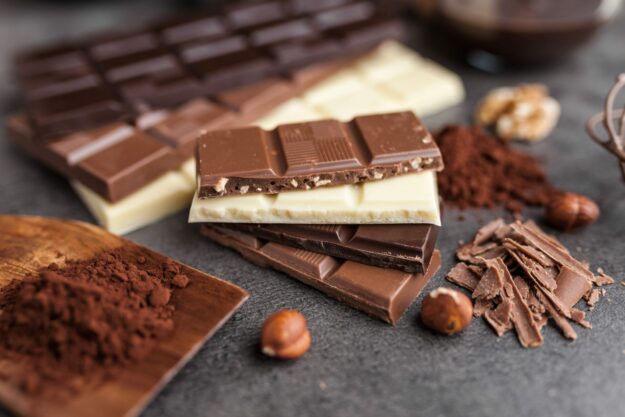 Delicious variety of chocole on rustic background