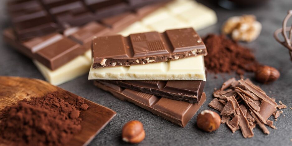 Delicious variety of chocole on rustic background